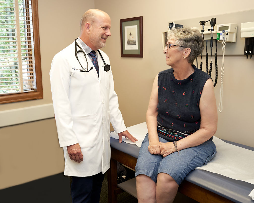 dr-christopher-and-patient-at-office-main-street-physicians-woodhaven-mi-usa (1)